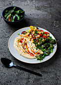 Hummus with tomato salad and roasted peppers