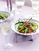 Asparagus with parma ham, arugula, tomatoes and balsamic