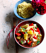 Cantonese chicken with pineapple, red peppers, spring onions and corncobs