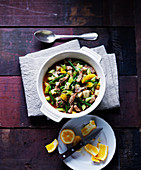 A stew made of pork, green beans, leeks, celery and oranges