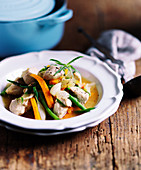 Chicken stew with carrots, green beans, shallots and rosemary