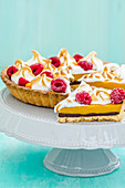 Lemon tart with meringue and raspberries
