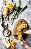 Womans hands slicing delicata squash