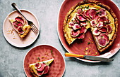 Creamed roasted cauliflower and fennel tart with watermelon raddish slices on top