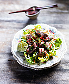 Spicy beef salad with lime, chilli, cucumber and lettuce