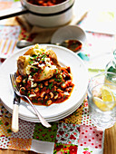 A baked potato with vegetable chili