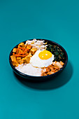 Bibimbap with spicy tofu, spinach, kimchi and fried egg (Korea)