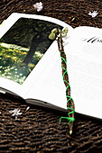 Budding branches of paperbush used as bookmark