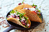 Tacos with provolone cheese and vegetables