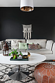 Bohemian-style living room with black wall