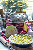 Uncooked cabbage quiche, eggs and homemade tagliatelle