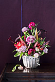 Autumnal bouquet of vegetables and flowers in cake tin