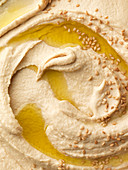 Hummus swirl with olive oil and sesame seeds