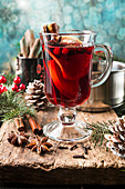 Hot mulled wine drink with lemon, apple, cinnamon, anise and other spices