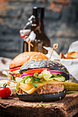 Tasty grilled classic beef black burger with lettuce and mayonnaise sauce