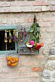 Garland of fabric tassels, dahlias and basket of pumpkins