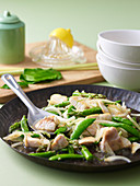 Stir-fried fish with kaffir lime and sugar snap peas