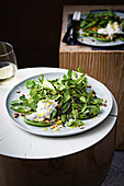 Grilled sugar snap peas with stracciatella and lemon