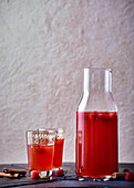 Warm rooibos, raspberry and rum cocktail