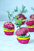 Mini vegan burgers with beetroot, carrots and lettuce