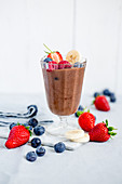 A chocolate banana shake with berries