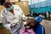 Hospital dentist treating a child