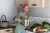 Woman using a pressure cooker