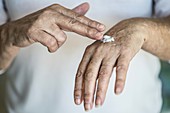 Woman applying cream on her hands