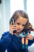 4 year-old girl using a phone