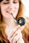 Woman eating liquorice ribbons