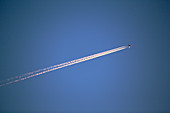 A plane flying over Leicestershire at sunset