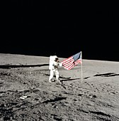 Apollo 12 commander unfurling US flag, 1969