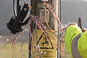 Telephone engineer repairing telephone lines