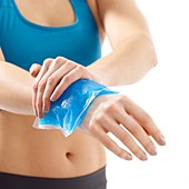 Woman with ice pack on her wrist