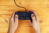 Hands using video game controller