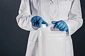 Chemist opening white plastic canister