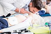 Doctor undertaking CPR training