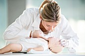 Doctor practising infant CPR