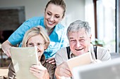 Senior couple using tablets