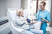 Woman having her blood pressure taken