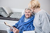 Senior couple reading book