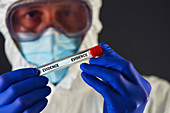 Forensic scientist with evidence tube