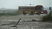 School bus turning in flood
