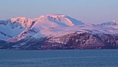 Snowy mountains on coast