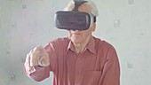 Elderly man with VR headset