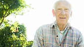 Elderly man in garden