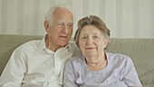 Elderly couple posing for a photo