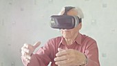 Elderly man with VR headset