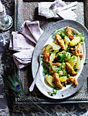 Chicken piccata with rocket, potatoes and lemon