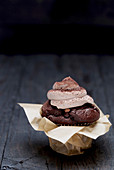 A chocolate muffin with cocoa cream